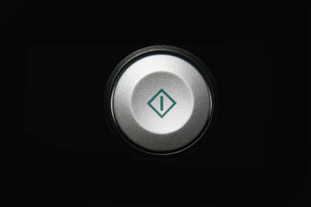 round button start on a black background