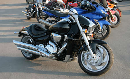 It is a lot of motorcycles parked on the asphalted areaの写真素材