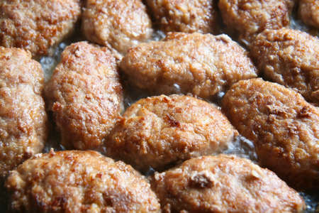 Natural meat cutlets fried on frying panの写真素材