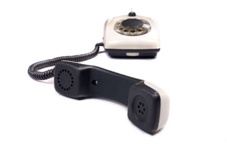 Old disk phone on white backgroundの写真素材