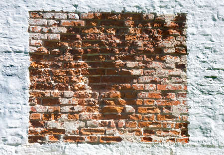 Old brick wall with white plasterの写真素材
