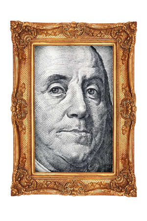 Portrait from hundred dollar banknotes in gold frameの写真素材