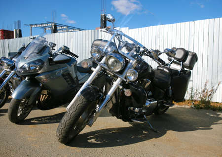 Group of motorcycles on parking in the afternoon near  fenceの写真素材
