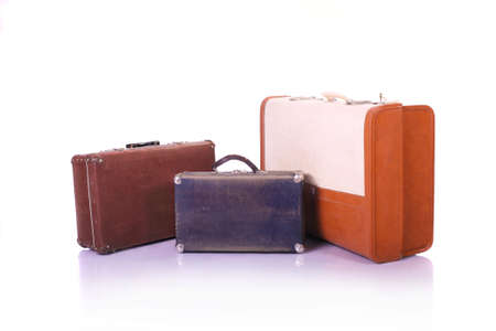 three old suitcases on white backgroundの写真素材