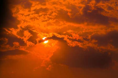 beautiful red sky with clouds and  sunの写真素材