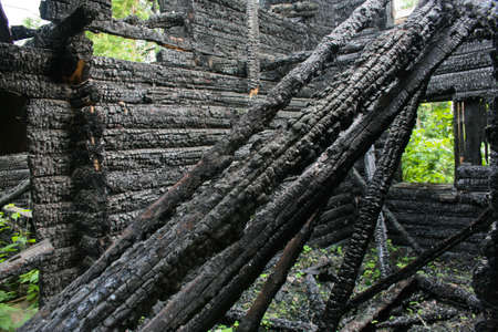 ruins of the burned-down wooden houseの写真素材