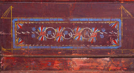 geometrical pattern on an old wooden claret backgroundの写真素材