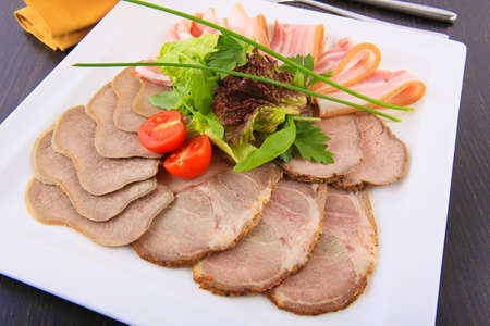 meat cutting of different types served on square plateの写真素材
