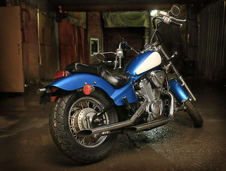 beautiful powerful blue motorcycle in garageの写真素材