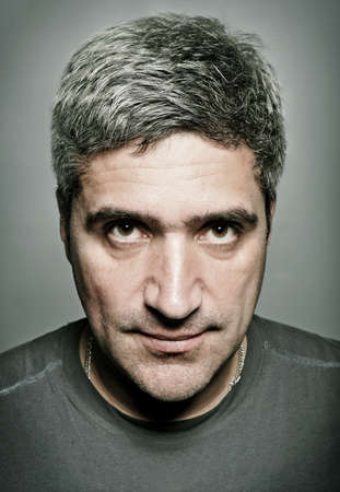 portrait of the adult man with gray hair