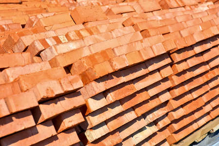 red bricks laid in pallets outsideの写真素材