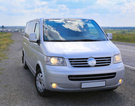 minibus on the country highway against landscape