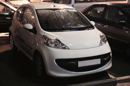 white car on parking at rainy nightの写真素材