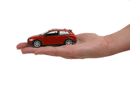 toy red car on female handの写真素材