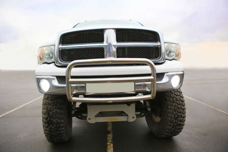 big white SUV with big wheels