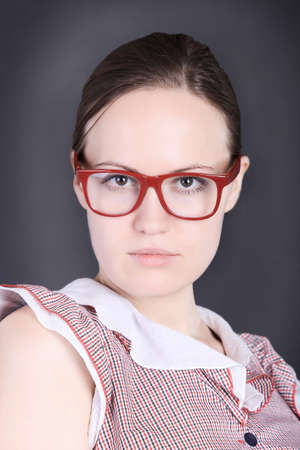 portrait of the beautiful strict girl wearing spectaclesの写真素材