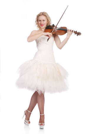 beautiful woman in white dress plays violinの写真素材