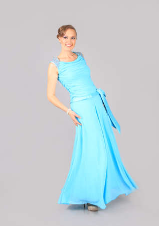elegant young woman in blue dressの写真素材