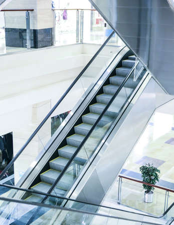 escalator steps in an interior of shopping center