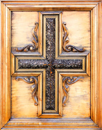 wooden figured Catholic cross in wooden frameの写真素材
