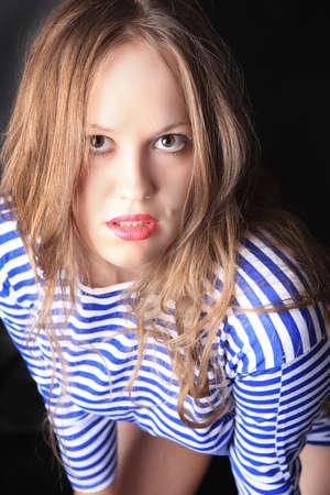 smiling beautiful young woman in striped hoodieの写真素材