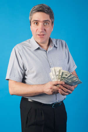 adult man holds money in handの写真素材