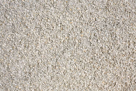 wall surface from small white stones の写真素材