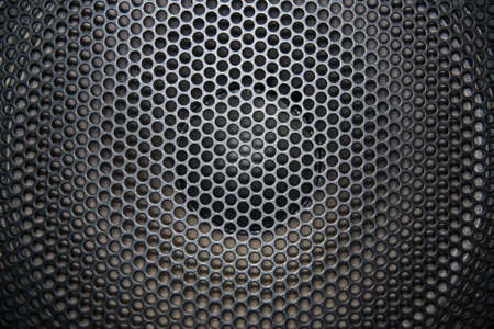 loudspeaker grid with round openings for backgroundの写真素材