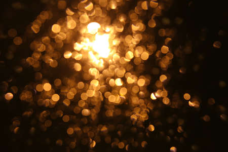 abstract golden circles against dark background