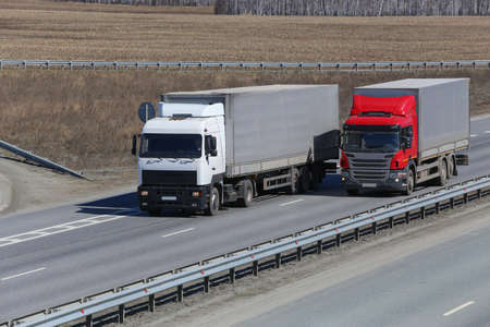 trucks transporting freight on the country highwayの写真素材