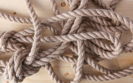 thick hempen rope on wooden boardの写真素材