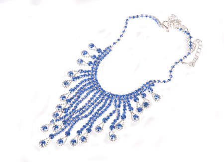 beautiful necklace with blue stones is isolated on the whiteの写真素材