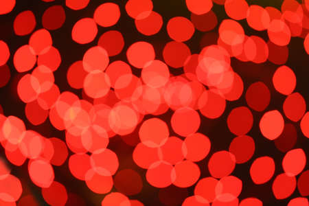 red round abstract spots of light against dark backgroundの写真素材