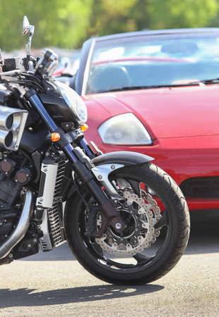 motorcycle and car on the road close up