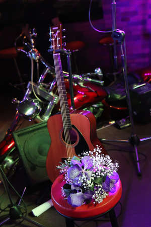 guitar and motorcycle on scene of night clubの写真素材