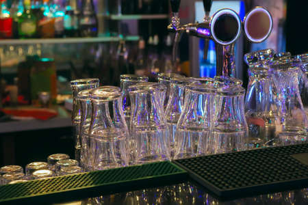 bar counter with beer glassesの写真素材