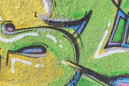 Colourful drawing of graffiti on concrete wall