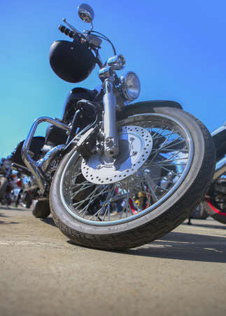 big black motorcycle on asphalt against  skyの写真素材