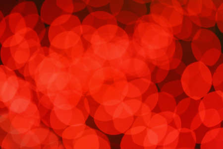 red round abstract spots of light against dark backgroundの写真素材