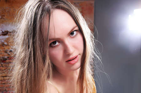 portrait of the beautiful sensual blonde in studio close upの写真素材