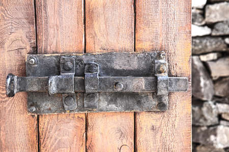 old metal bolt on wooden doorの写真素材