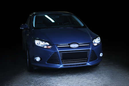 modern dark blue car on black backgroundの写真素材