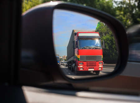 red truck reflection in a car mirrorの写真素材
