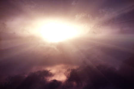 beautiful heavenly landscape with bright sun in cloudsの写真素材