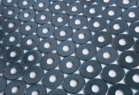 metal chromeplated shining washers backgroundの写真素材