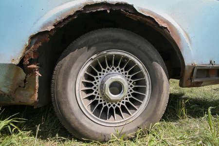 old car with rust on body close upの写真素材