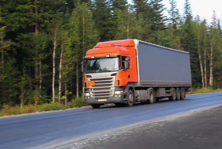big truck moves on country highwayの写真素材