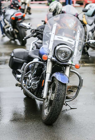 many motorcycles on parking on asphalt  close upの写真素材