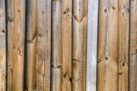 Wooden fence  from rough pine boardsの写真素材
