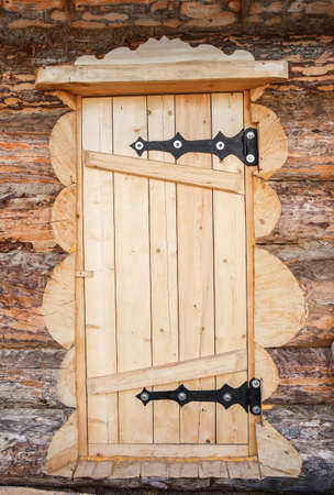 wooden door of log house close upの写真素材